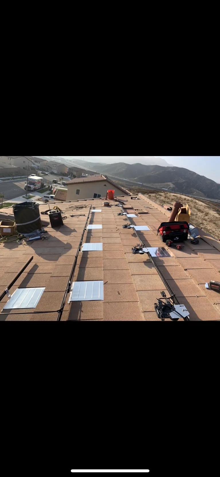 Roof prepped with mounting rails before panels
