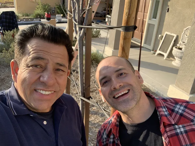 Two SolarCCS installers on a job site serving Perris, CA